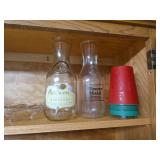 Kitchen Cabinet Collection with Decorated Teapot, Coffee Mugs, Carafes, Spice Rack, and More