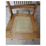 Vintage Carved Wood Rocking Chair with Cane Seat