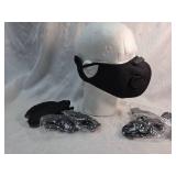 Reusable face mask featuring dual breathing valves, adjustable ear straps, and washable fabric construction. Includes multiple mask pieces in sealed packaging