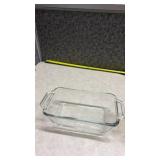 Anchor Hocking Clear Glass Loaf Pan and a Pyrex Brown Loaf Pan