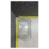 Anchor Hocking Clear Glass Loaf Pan and a Pyrex Brown Loaf Pan