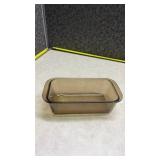 Anchor Hocking Clear Glass Loaf Pan and a Pyrex Brown Loaf Pan