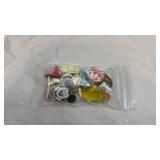 Vintage Disney-themed charms, keychains, pins and rings