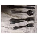 Silver Flatware Set with Wavy Handle Design