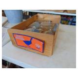 Wooden crate with old canning jars