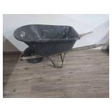 Black Wheelbarrow with Wooden Handles (bucket is cracked and tire need air or replaced) Black Wheelbarrow with Wooden Handles (bucket is cracked and tire need air or replaced)