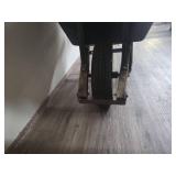 Black Wheelbarrow with Wooden Handles (bucket is cracked and tire need air or replaced) Black Wheelbarrow with Wooden Handles (bucket is cracked and tire need air or replaced)