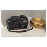 Brass ashtrays and Lexxus camera