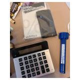 Calculators, doorknob, small levels, measuring tapes, magnifying glass, more