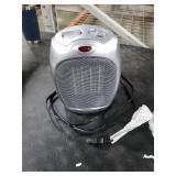 Amazon Basics Ceramic Space Heater, Portable Indoor Heating Solution, With Overheat and Tip-Over Protection, Thermostat, Non-Oscillating, 1500W, Fast Heating, 7.52D x 6.34W x 9.45H, Silver