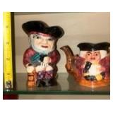 Staffordshire Toby Jugs and a matching Toby Jug Teapot made by Shorter & Son, Ltd in England. These are vintage, hand-painted ceramic collectibles. The design is a classic \"Toby\" style, which origin