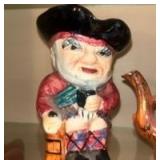 Staffordshire Toby Jugs and a matching Toby Jug Teapot made by Shorter & Son, Ltd in England. These are vintage, hand-painted ceramic collectibles. The design is a classic \"Toby\" style, which origin