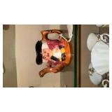 Staffordshire Toby Jugs and a matching Toby Jug Teapot made by Shorter & Son, Ltd in England. These are vintage, hand-painted ceramic collectibles. The design is a classic \"Toby\" style, which origin