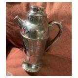 vintage Art Deco-style chrome cocktail shaker.