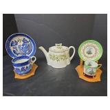 Teapot with Daisy Pattern, 2 Cups with Saucers, and 2 Wooden Stands