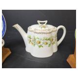 Teapot with Daisy Pattern, 2 Cups with Saucers, and 2 Wooden Stands
