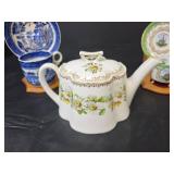 Teapot with Daisy Pattern, 2 Cups with Saucers, and 2 Wooden Stands