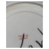 Teapot with Daisy Pattern, 2 Cups with Saucers, and 2 Wooden Stands