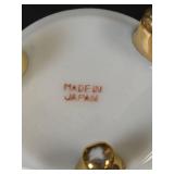 Teapot with Daisy Pattern, 2 Cups with Saucers, and 2 Wooden Stands