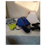 Dog lot including cone, sweater, and harnesses.