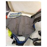 Dog lot including cone, sweater, and harnesses.