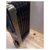 1500-Watt Black Indoor Electric Oil-Filled Radiator Convection Radiant Space Heater with Remote Control for Living Space - Retail: $100