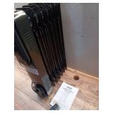 1500-Watt Black Indoor Electric Oil-Filled Radiator Convection Radiant Space Heater with Remote Control for Living Space (Missing Wheels)- Retail: $100