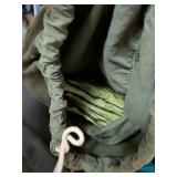 One large teal bag military duffel bag and another bag