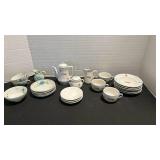 Two miniature tea sets.  Neither is complete.