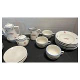 Two miniature tea sets.  Neither is complete.