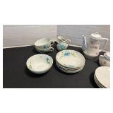 Two miniature tea sets.  Neither is complete.