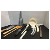 Kitchen utensils including  garlic press