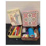 Pens and pencils in tins