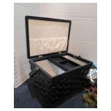 Black wicker sewing basket with craft supplies