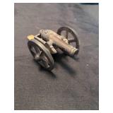 Antique sherry glasses with Cast Iron Civil War Cannon and vase with brass base