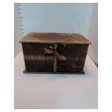 Brown velvet storage box with old photographs