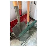 Two shovels and a rake