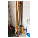 Pitchfork, garden tools and a broom