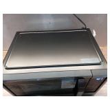 21 in. 1.1 cu. ft. 1000-Watt Countertop Microwave Oven in Fingerprint Resistant Stainless Steel and Bar handle - Retail: $109