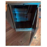 Side table/cabinet with magazine rack and pull out table. 1908 Sears Roebuck & Co. Garden Encyclopedia Book included.