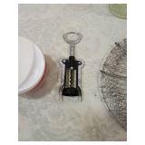 Manual Food Chopper with Red Base, steamer, wine bottle opener, glass dispenser, and vegetable chopper Manual Food Chopper with Red Base, steamer, wine bottle opener, glass dispenser, and vegetable chopper