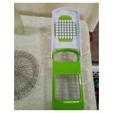 Manual Food Chopper with Red Base, steamer, wine bottle opener, glass dispenser, and vegetable chopper Manual Food Chopper with Red Base, steamer, wine bottle opener, glass dispenser, and vegetable chopper