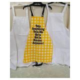 Wizard of Oz Yellow Gingham Apron with Quote and two white aprons Wizard of Oz Yellow Gingham Apron with Quote and two white aprons