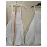 Wizard of Oz Yellow Gingham Apron with Quote and two white aprons Wizard of Oz Yellow Gingham Apron with Quote and two white aprons