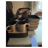 Set of beige, black dishes