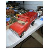 Red Structo hydraulic dumper