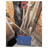 All shovels & other tools in corner