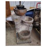 water fountain and fake tree