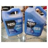 open jugs of oil and antifreeze