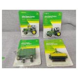 Four small John Deere toys